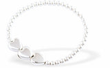 Silver Coloured Stretch, Beaded, Slip On Bracelet, Rhodium Plated with Triple Heart Charms
