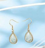 Artisan Delicate White Shell Drop Earrings Golden Coloured Titanium Steel 20mm drop Hypoallergenic: Nickel, Lead and Cadmium Free Delivered in a soft, black, velveteen pouch 