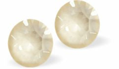 Sparkly Austrian Crystal Diamond-shape and Elegant Stud Earrings Round, Multi Faceted Crystal 6mm in size Colour: Warm Creamy Linen Ignite Delivered in a soft, black, velveteen pouch Perfect for an evening out or sophisticated, elegant day wear.