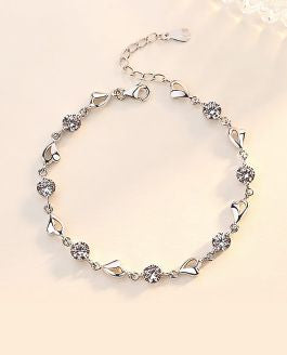 Sparkly Link Bracelet with Extension Clear Crystal and wild Heart Links 6cm in diameter, Rhodium Plated Nickel Free, Hypoallergenic Delivered in a soft, black, velveteen pouch