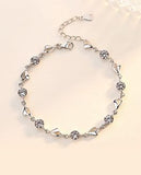 Sparkly Link Bracelet with Extension Clear Crystal and wild Heart Links 6cm in diameter, Rhodium Plated Nickel Free, Hypoallergenic Delivered in a soft, black, velveteen pouch
