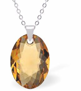 Embellished with Crystals by Swarovski® Multi Faceted Oval Elliptic Necklace Golden Topaz in Colour 16mm in size Choice of 18" Stainless Steel or Sterling Silver Chain Hypo allergenic: Free from Lead, Nickel and Cadmium See matching earrings EL77 Delivered in a soft, grey, velveteen pouch