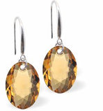 Austrian Crystal Multi Faceted Oval Elliptic Drop Earrings Golden Topaz in Colour 11.5mm in size - Rhodium Plated Earwires Hypo allergenic: Free from Lead, Nickel and Cadmium See matching necklace EL76 Delivered in a soft, black, velveteen pouch