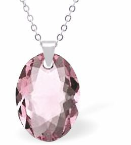 Embellished with Crystals by Swarovski® Multi Faceted Oval Elliptic Necklace Light Rose Pink in Colour 16mm in size Choice of 18" Stainless Steel or Sterling Silver Chain Hypo allergenic: Free from Lead, Nickel and Cadmium See matching earrings EL83 Delivered in a soft, grey, velveteen pouch