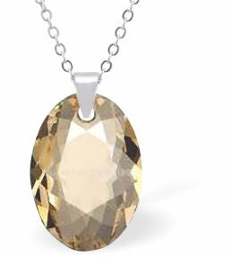 Embellished with Crystals by Swarovski® Multi Faceted Oval Elliptic Necklace Golden Shadow in Colour 16mm in size Choice of 18" Stainless Steel or Sterling Silver Chain Hypo allergenic: Free from Lead, Nickel and Cadmium See matching earrings EL85 Delivered in a soft, grey, velveteen pouch