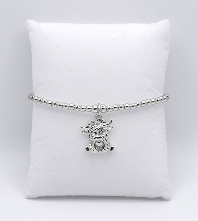 Stretch Charm Bracelet with Silver Coloured Beads and Bonnie Highland Cow Charm