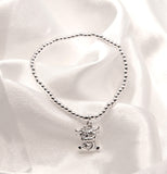 Stretch Charm Bracelet with Silver Coloured Beads and Bonnie Highland Cow Charm
