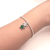 Stretch Charm Bracelet with Silver Coloured Beads and Bessie Highland Cow Charm