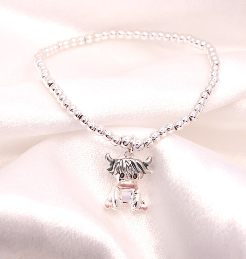 Stretch Charm Bracelet with Silver Coloured Beads and Rosie Highland Cow Charm