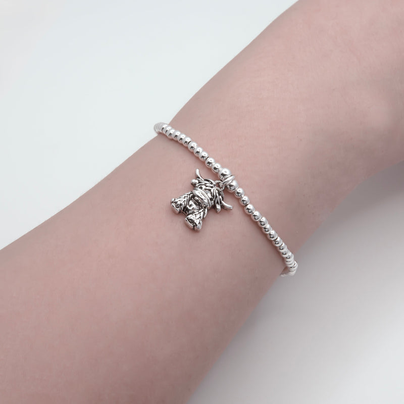 Stretch Charm Bracelet with Silver Coloured Beads and Maisie Highland Cow Charm