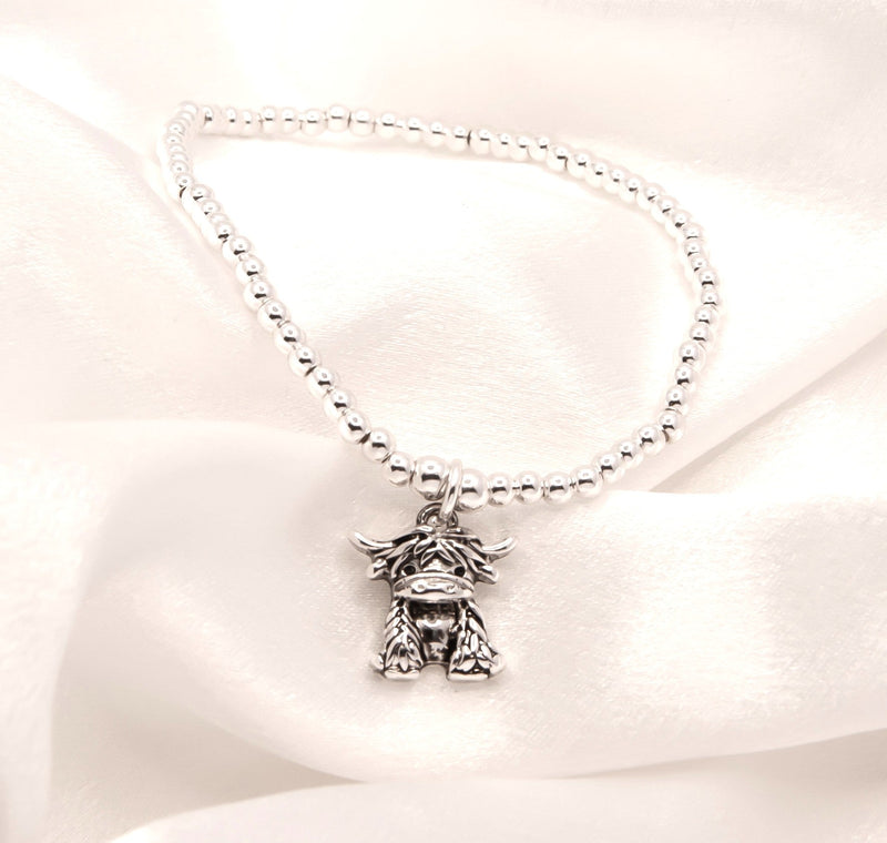 Stretch Charm Bracelet with Silver Coloured Beads and Maisie Highland Cow Charm