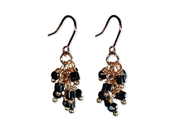 Multi-beaded Black Drop Earrings
&nbsp;Gold Coloured Fish-hooks, Rhodium Plated

See matching Double Necklace LB30
Delivered in a soft, grey, velveteen pouch