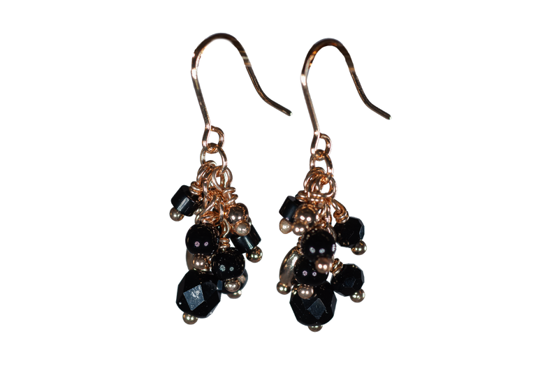 Multi-beaded Black Drop Earrings
&nbsp;Gold Coloured Fish-hooks, Rhodium Plated

Colour: Black, burgundy and purple
See matching Double Necklace LB36
Delivered in a soft, grey, velveteen pouch