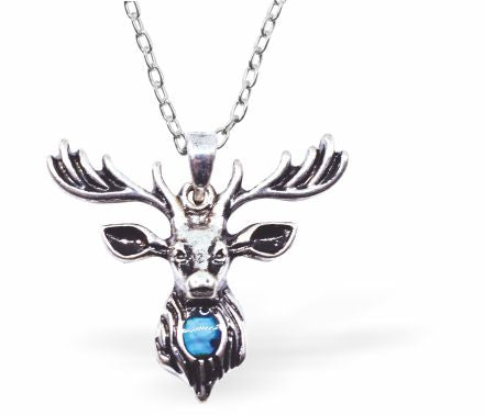 Natural Paua Shell Stag with Horns Necklace: Striking green-blue Paua shell stag pendant, 24mm in size, on an 18" rhodium-plated, hypoallergenic chain. Free from nickel, lead, and cadmium. Delivered in a soft black velveteen pouch.