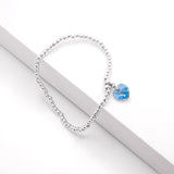 Charm Bracelet with Crystal Heart Charm Embellished with Crystals by Swarovski®  in Aquamarine Blue, Rhodium Plated