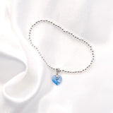 Charm Bracelet with Crystal Heart Charm Embellished with Crystals by Swarovski®  in Aquamarine Blue, Rhodium Plated