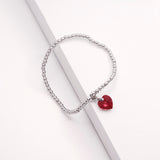 Charm Bracelet with Crystal Heart Charm Embellished with Crystals by Swarovski® in Siam Red, Rhodium Plated