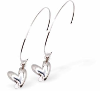 Hoop Earrings with Heart Drops, Silver Coloured
Hearts are 10mm in size
Colour: Silver
Rhodium Plated Ear-wires
Delivered in a soft, black, velveteen pouch