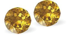 Sparkly Austrian Crystal Diamond-shape, Elegant Stud Earrings Round, Multi Faceted Crystal  6mm in diameter Colour: Golden Topaz Sterling Silver Earwires Delivered in a soft, black, velveteen pouch