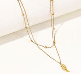 Double Layered Golden Titanium Steel Chain Necklace, ornate with Wing Drop