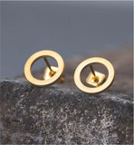 Artisan Delicate Circle Stud Earrings Golden Coloured Titanium Steel 8mm in size Hypoallergenic: Nickel, Lead and Cadmium Free Delivered in a soft, black, velveteen pouch 