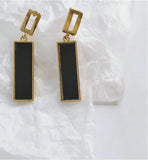Artisan Delicate Rectangular Drop Earrings in Black Golden Coloured Titanium Steel 45mm in size Hypoallergenic: Nickel, Lead and Cadmium Free Delivered in a soft, black, velveteen pouch 