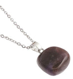 Artisan Natural Stone Single Amethyst Necklace Amethyst: relieve stress and anxiety in your life Crystal drop is 20mm in size Titanium Steel Extension Chain Hypoallergenic: Nickel, Lead and Cadmium Free Delivered in a soft, black, velveteen pouch