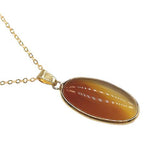 Artisan Natural Crystal Red Agate Oval Necklace Red Agate: passion, love and perseverance Golden Titanium Steel Chain 30mm crystal drop Hypoallergenic: Nickel, Lead and Cadmium Free Delivered in a soft, black, velveteen pouch 