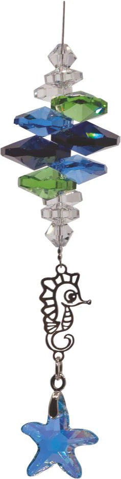 Sparkling Multi Faceted Crystal Suncatcher  Featuring a Large Crystal Denim Blue Starfish Drop Rhodium Plated Seahorse Link Drop: 21cm from hanging loop to bottom (Approximate) Hang in the window or near a light source for full effect Delivered in a soft, black, velveteen pouch